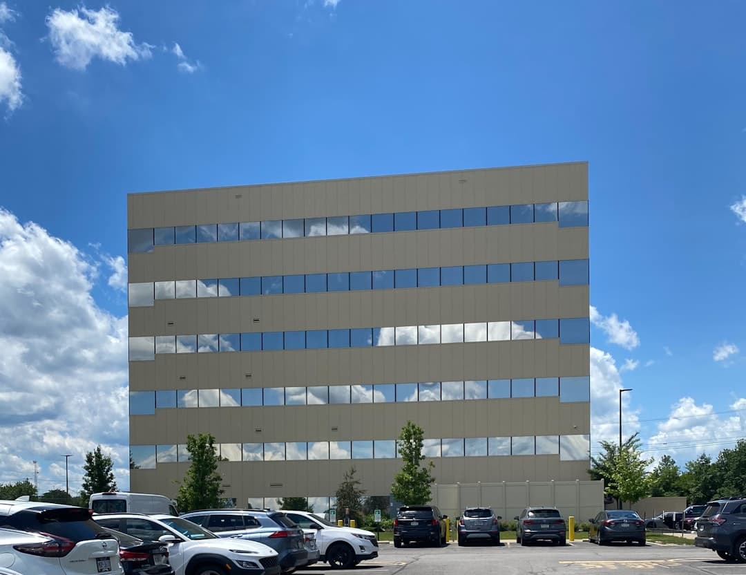 Modern commercial office building with a parking lot
