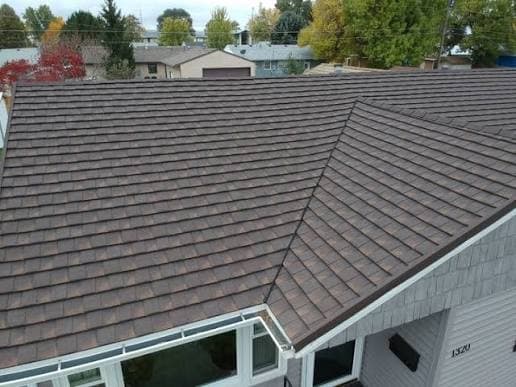 Aerial view of a home with premium multi-plane shingle roofing