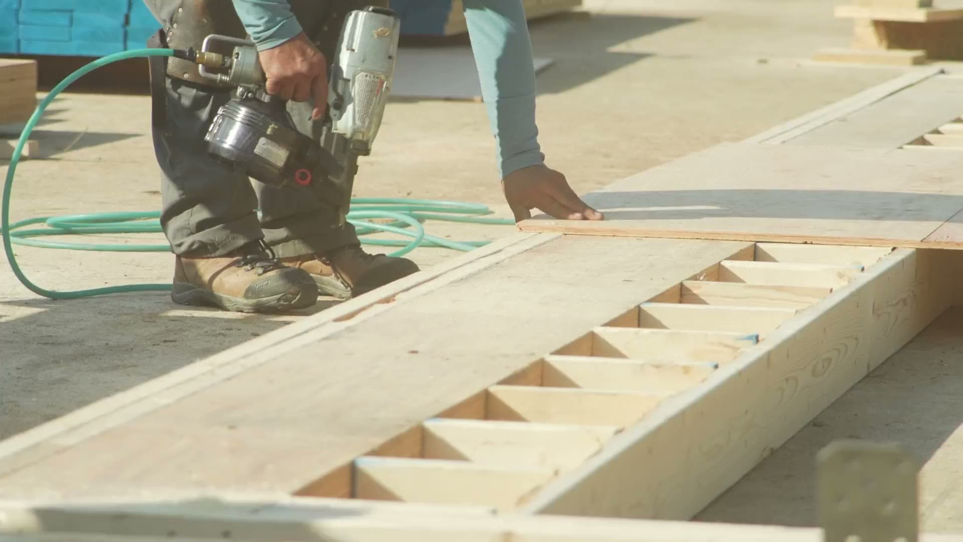 E4 Construction roofing crew installing a metal roof